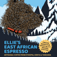 Adventure Dog Coffee Co.'s Ellie the Cairn Terrier illustrated on the label of Ellie’s African Espresso, a dark roast blend with flavors from Kenya, Tanzania, and Ethiopia, featuring notes of wildflowers, dark berry, hibiscus, and honey.
