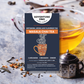 Masala Chai Tea | Artisanal Loose Leaf label over a background of a mug of tea, a spice infuser, and spices. Flavor notes are cardamom, cinnamon, and ginger.