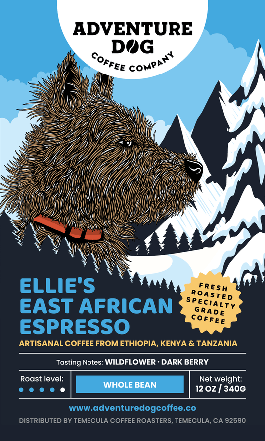 Adventure Dog Coffee Co.'s Ellie the Cairn Terrier illustrated on the label of Ellie’s African Espresso, a dark roast blend with flavors from Kenya, Tanzania, and Ethiopia, featuring notes of wildflowers, dark berry, hibiscus, and honey.